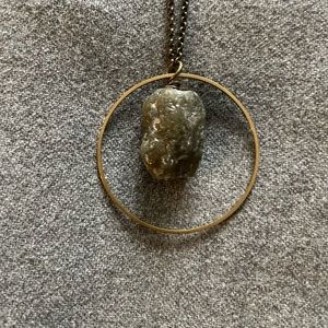 36" chain necklace with simple circle showcasing a raw stone. Simple